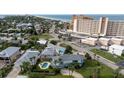 Elevated view of a house with a pool near the beach at 320 Due East St, New Smyrna Beach, FL 32169