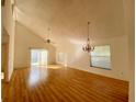 Bright living room featuring hardwood floors, a ceiling fan, and chandelier at 101 Braeburn Cir, Daytona Beach, FL 32114