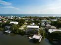 Elevated view of waterfront home and surrounding neighborhood at 824 Eel Ave, New Smyrna Beach, FL 32169