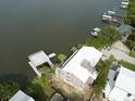 Aerial view of waterfront home with private dock and boat slip at 824 Eel Ave, New Smyrna Beach, FL 32169