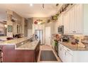 Modern kitchen with granite counters and stainless steel appliances at 728 Sea Duck Dr, Daytona Beach, FL 32119