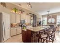 Gourmet kitchen with granite island and breakfast bar at 728 Sea Duck Dr, Daytona Beach, FL 32119