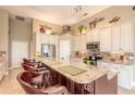 Spacious kitchen with granite counters and island at 728 Sea Duck Dr, Daytona Beach, FL 32119
