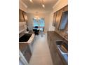 Open concept kitchen and dining area with modern light fixtures at 840 Center Ave # 840, Daytona Beach, FL 32117