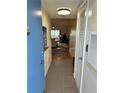 Condo entryway with tiled floor and access to living room at 721 S Beach St # 214A, Daytona Beach, FL 32114