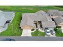 Aerial view of property and community with golf course at 11 Andrea Dr, New Smyrna Beach, FL 32168