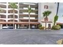 Covered parking area with several cars parked underneath a building at 731 Marina Point Dr # 7310, Daytona Beach, FL 32114