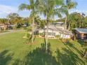 Aerial view of mid-century modern home with large yard at 501 S Peninsula Ave, New Smyrna Beach, FL 32169