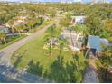 Aerial view of mid-century modern home, showcasing its location and yard at 501 S Peninsula Ave, New Smyrna Beach, FL 32169
