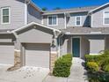 Two-story townhome with attached garage at 679 Mount Olympus Blvd, New Smyrna Beach, FL 32168