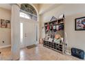 Bright entryway with tile flooring, coat rack, and bench at 510 Sun Lake Dr, Port Orange, FL 32127