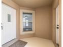 Light and bright entryway with white door and window at 2266 Hawks Cove Cir, New Smyrna Beach, FL 32168