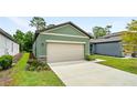 Exterior view of the home's two-car garage at 2352 Litchfield Loop, Deland, FL 32720
