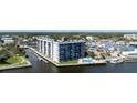 Multi-story waterfront building with a pool and marina views at 101 N Riverside Dr # 1140, New Smyrna Beach, FL 32168