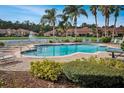 Community pool with lounge chairs, landscaping, and nearby residences at 3608 Romea Cir, New Smyrna Beach, FL 32168