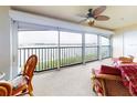 Living room with water views and sliding glass doors at 452 Bouchelle Dr # 303, New Smyrna Beach, FL 32169