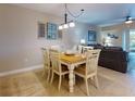 Charming dining area with a farmhouse table and coastal decor at 5300 S Atlantic Ave # 12-206, New Smyrna Beach, FL 32169