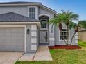 Two-story house with gray siding and double door entry at 5336 Georgia Peach Ave, Port Orange, FL 32128