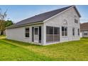 Single story home with a screened porch at 5336 Georgia Peach Ave, Port Orange, FL 32128