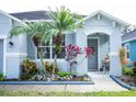 Front view of the house showcasing landscaping and a welcoming entrance at 617 Aeolian Dr, New Smyrna Beach, FL 32168