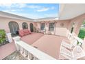 Peaceful patio area with seating and fountain at 110 Ponce Terrace Cir, Ponce Inlet, FL 32127