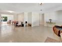 Bright dining area with tile flooring and access to the kitchen at 1527 Magnolia St, New Smyrna Beach, FL 32168