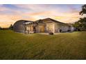 Spacious backyard with screened patio and lawn at 2354 Legacy Ln, New Smyrna Beach, FL 32168
