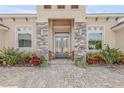 Elegant front entry with stone pillars and double doors at 2354 Legacy Ln, New Smyrna Beach, FL 32168