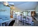 Open living room with vaulted ceilings and access to the backyard at 3218 Royal Palm Dr, Edgewater, FL 32141