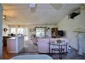 Bright and airy living room with comfortable seating and views of the backyard at 3218 Royal Palm Dr, Edgewater, FL 32141
