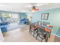 Bright dining area with table and chairs, adjacent to living room at 4590 S Atlantic Ave # 263, Ponce Inlet, FL 32127