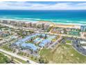 Aerial view showing proximity to beach and community pool at 4590 S Atlantic Ave # 263, Ponce Inlet, FL 32127