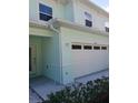 Two-car garage with attached townhouse at 555 Coronado Cove Rd, New Smyrna Beach, FL 32168