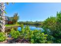 Scenic view of a peaceful canal with lush vegetation at 114 Cedar Dunes Dr, New Smyrna Beach, FL 32169