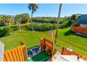 Charming patio area with wooden fence and canal view at 114 Cedar Dunes Dr, New Smyrna Beach, FL 32169