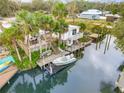 Charming waterfront home with private dock and boat lift at 130 Indian Creek Rd, Oak Hill, FL 32759