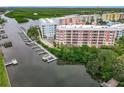 Waterfront community with boat docks and lush landscaping at 2 Riverwalk Dr # 302, New Smyrna Beach, FL 32169