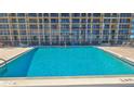 Refreshing rooftop pool with ample deck space at 4139 Atlantic # A406, New Smyrna Beach, FL 32169