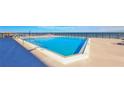 Ocean view rooftop pool with lounge chairs at 4139 Atlantic # A406, New Smyrna Beach, FL 32169