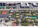 Aerial view showing property's location within a complex near tennis courts and pool at 4150 S Atlantic Ave # 103A, New Smyrna Beach, FL 32169