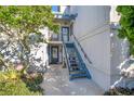 Condo building exterior with stairs leading to entrance at 4411 Sea Mist Ct # 275, New Smyrna Beach, FL 32169