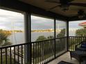 Relaxing screened balcony overlooking waterfront with city views at 460 Bouchelle Dr # 305, New Smyrna Beach, FL 32169