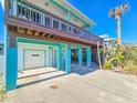 Two-story beach house with garage and large deck at 6244 S Atlantic Ave, New Smyrna Beach, FL 32169