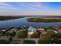 Waterfront property showcasing a beautiful home and canal views at 73 Cunningham Dr, New Smyrna Beach, FL 32168