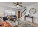 Spacious living room with a sofa, coffee table, and large TV at 101 N Pine St # 7, New Smyrna Beach, FL 32169