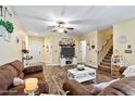 Spacious living room with hardwood floors and a staircase at 118 Grey Widgeon Ct, Daytona Beach, FL 32119