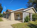 Tan house with carport and white lattice at 40 Sandra Cir, New Smyrna Beach, FL 32168