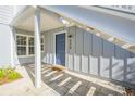 Private condo entrance with a blue door and address number at 4278 Sun Village Ct # 27D, New Smyrna Beach, FL 32169