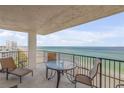 Spacious balcony with seating and ocean views at 5499 S Atlantic Ave # 905, New Smyrna Beach, FL 32169