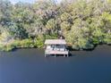 Wooden dock with a covered seating area on the waterfront at 6307 Palmas Bay Cir, Port Orange, FL 32127